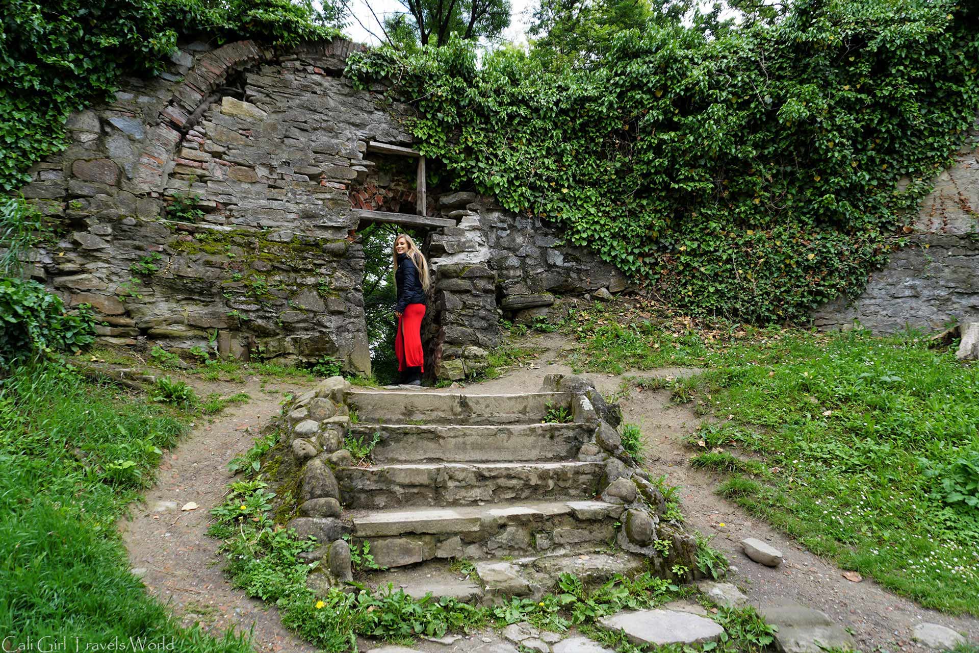 Cali Girl Travels World walking through a passageway in Sighisoara, Romania. 